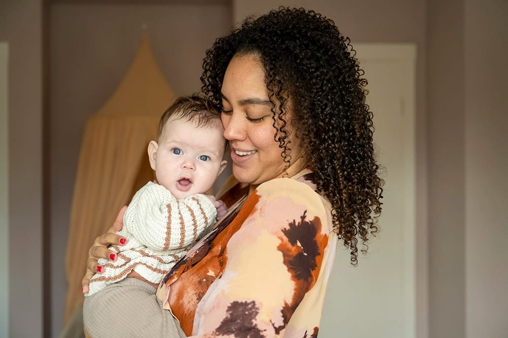 Young mom holding her child.
