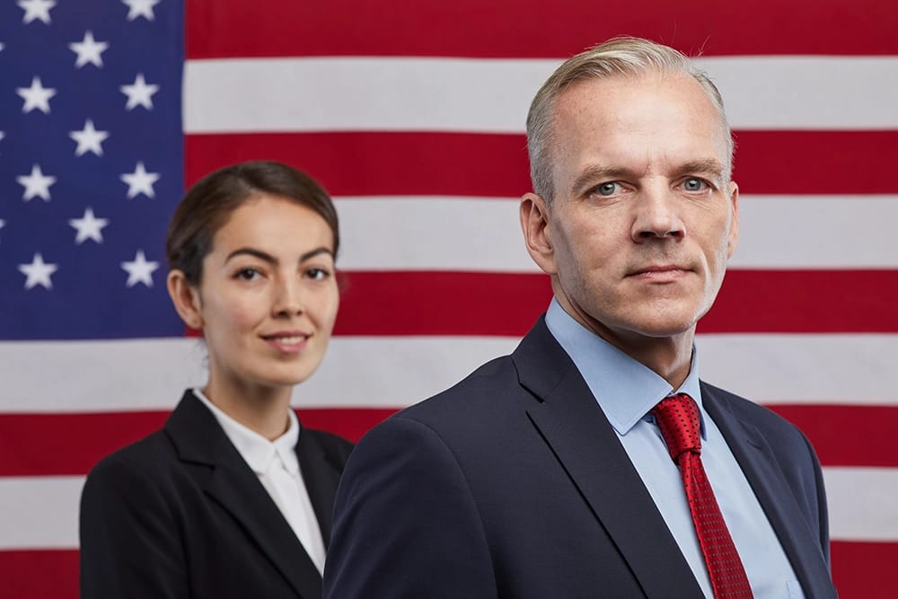political candidates in front of a flag