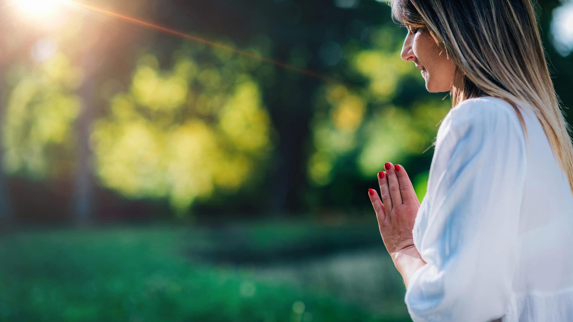 Meditation by the Water, Hands in Prayer Position. Woman praying