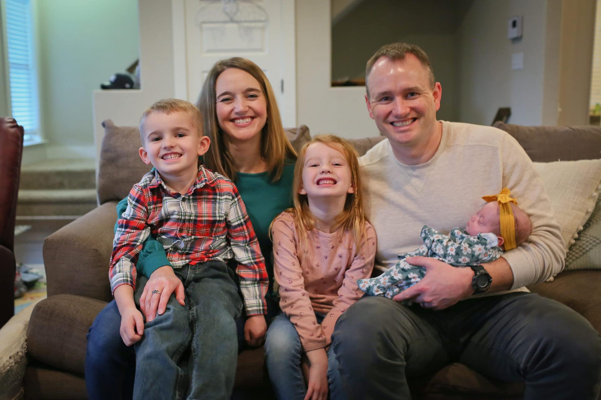 aaf grant Picture of family with newborn baby in father's arms